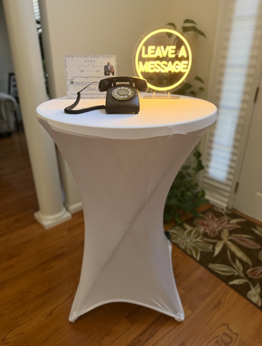 Black vintage-style audio telephone guest book displayed with a Leave a Message sign